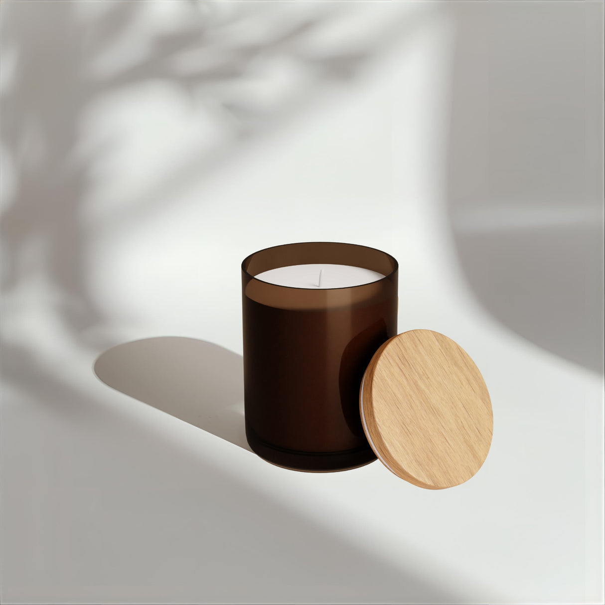 Brown candle with wooden lid on a light background