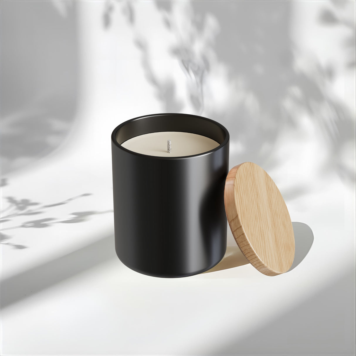 Black candle with a wooden lid on a light background