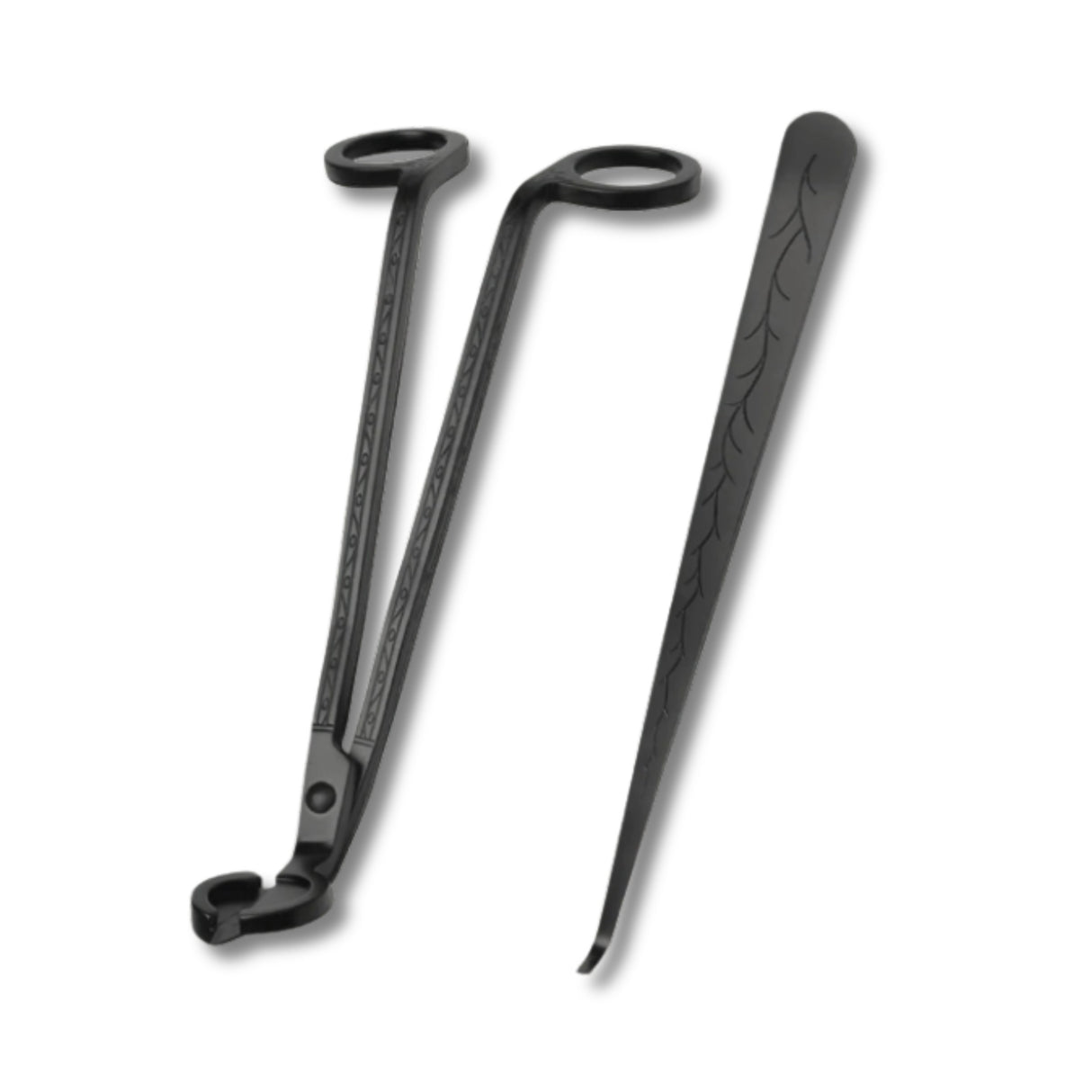 Black metal tools with decorative patterns on a white background