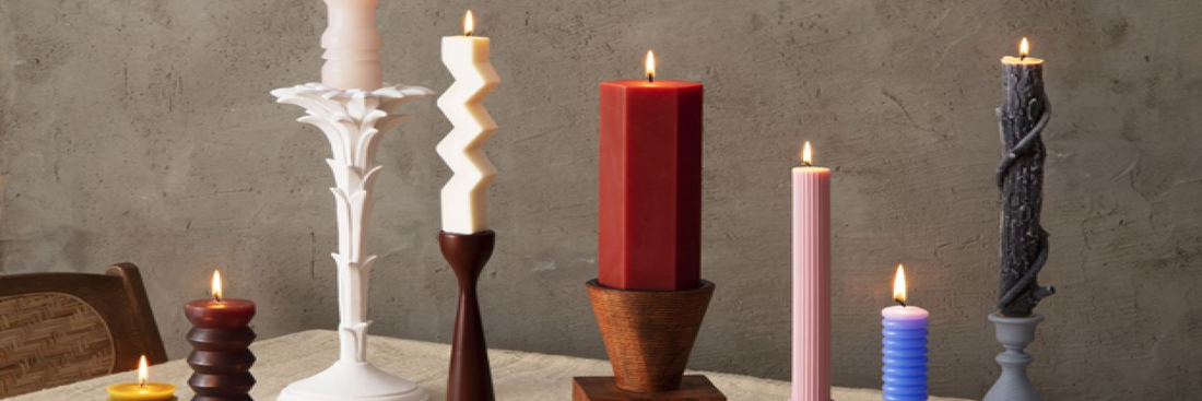 A set-up of various tapered candles in quirky shapes. Sourced from House Beautiful