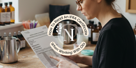 a woman reading an IFRA Certificate for a fragrance oil