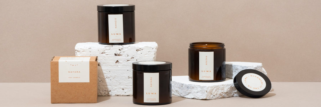 A marketing image of branded candles positioned at different levels. Sourced from Unsplash.