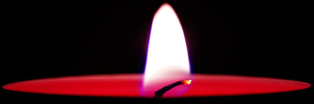 A zoomed-in shot of a burning candle wick
