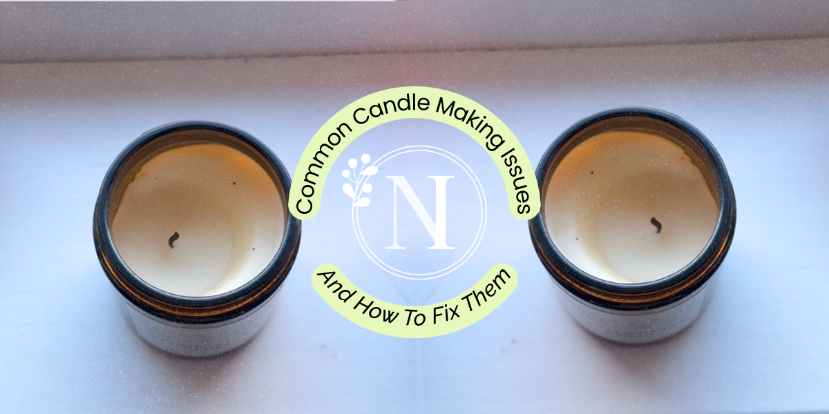 a candle sitting on a wooden pallet next to a potted plant