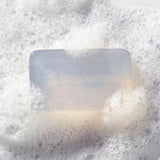 Bar of soap with 'Stephenson's' branding on a foamy  background