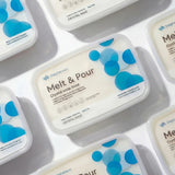 Multiple containers of Stephenson Melt & Pour crystal soap base on a light gray background