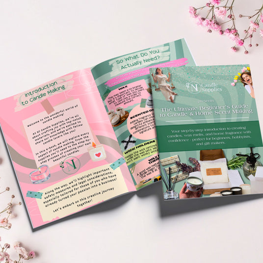 Open book with text and images on a white surface with flowers