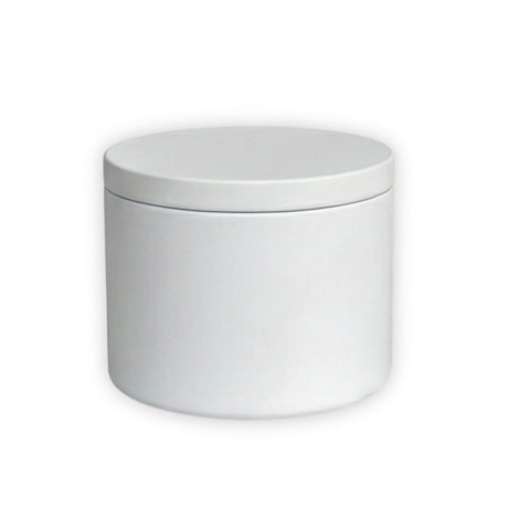 White candle tin with lid on a white background