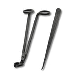 Black metal tools with decorative patterns on a white background