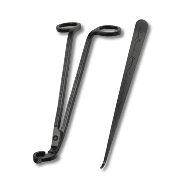 Black metal tools with decorative patterns on a white background