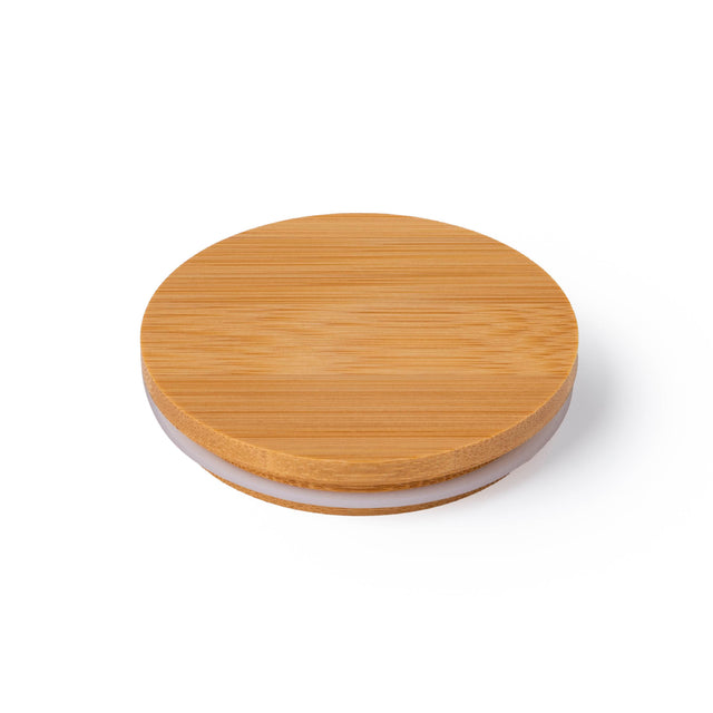 Round wooden candle lid on a white background